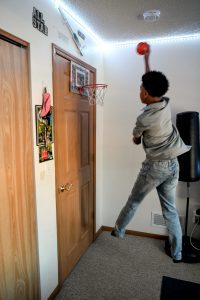 Rider dunks a basketball in his room
