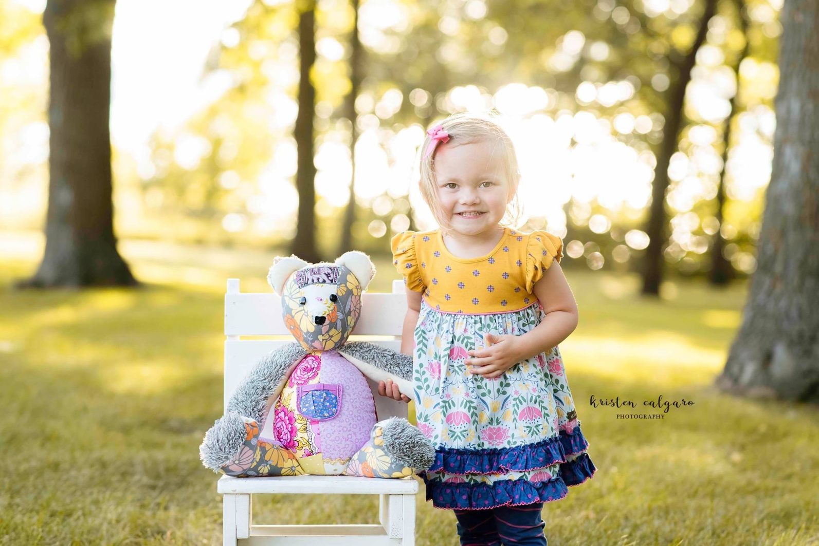 Kenedi holding Kendal's bear