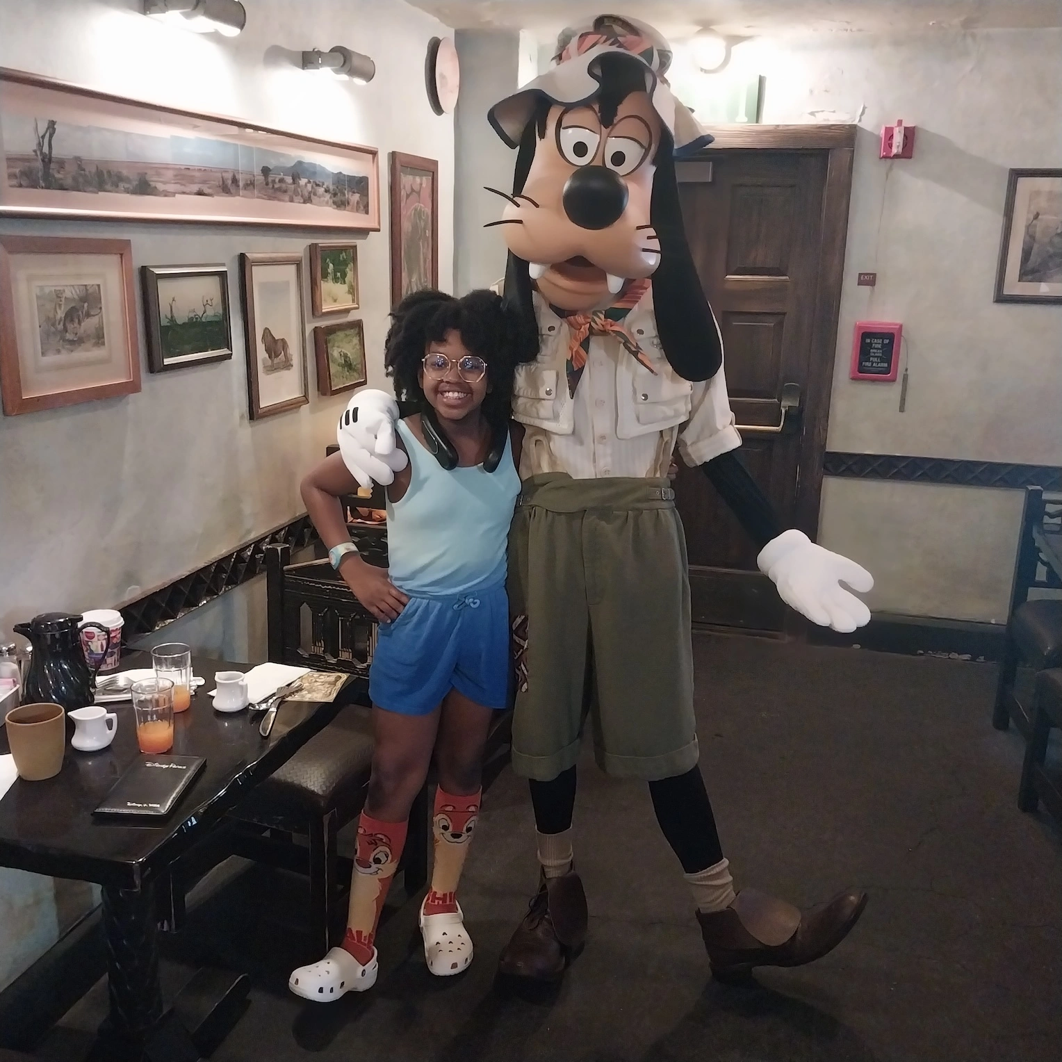 Val posing with Goofy at Disney