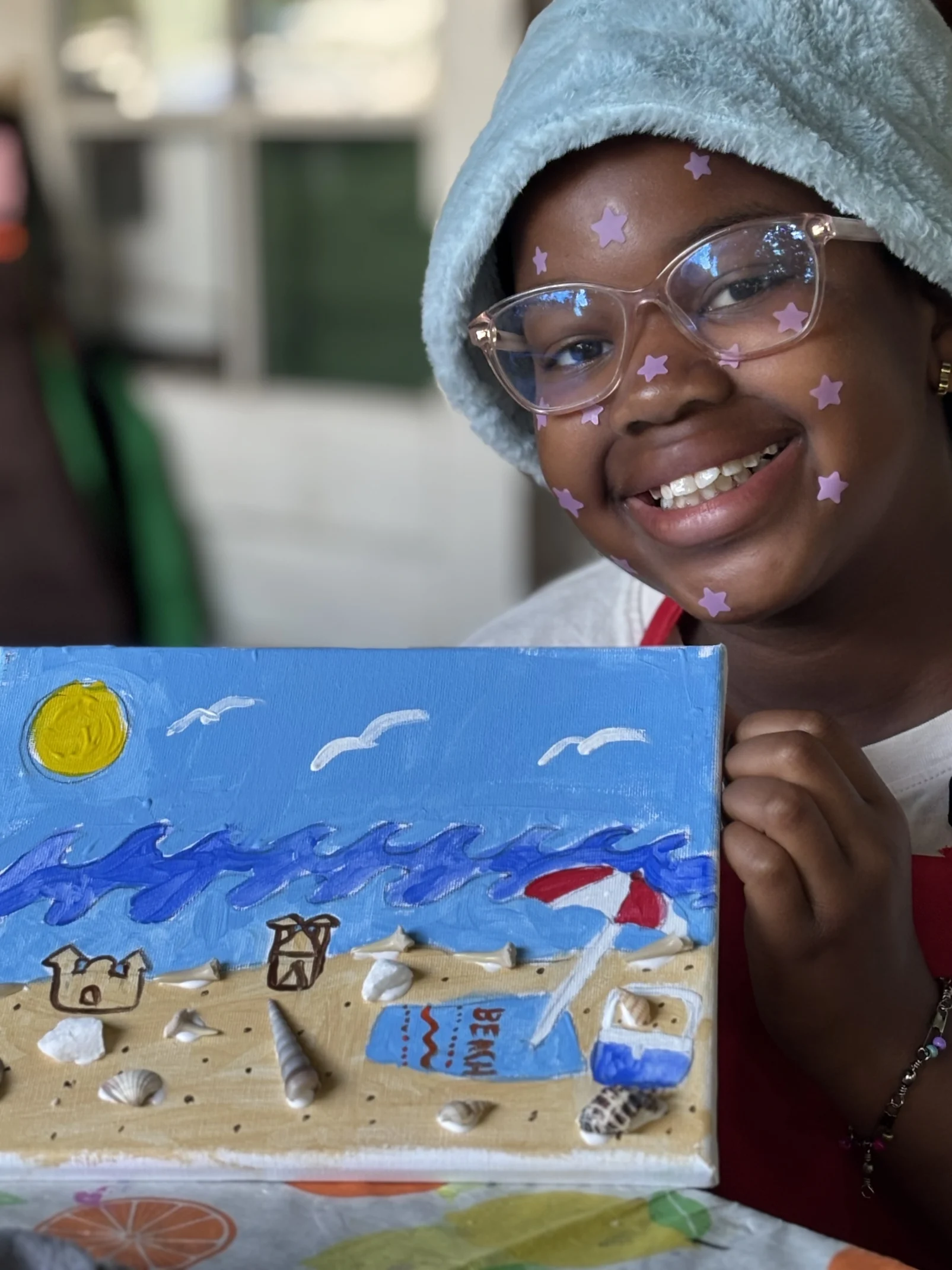 Val posing with artwork