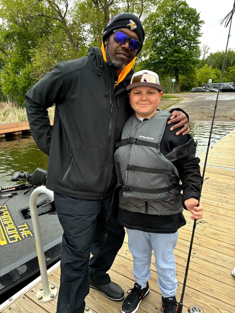 Randy Moss and Isaac, CCRF ambassador