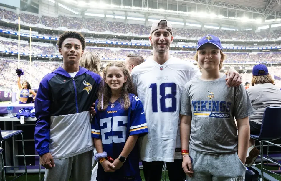 Alex with other CCRF ambassadors at a pre-season Vikings game