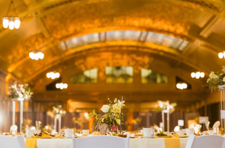 A bright, warm lit formal gala venue