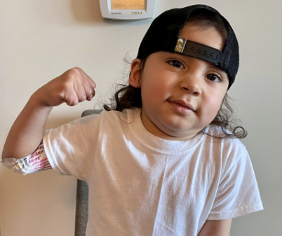 Jasper posing for a picture in his hospital room
