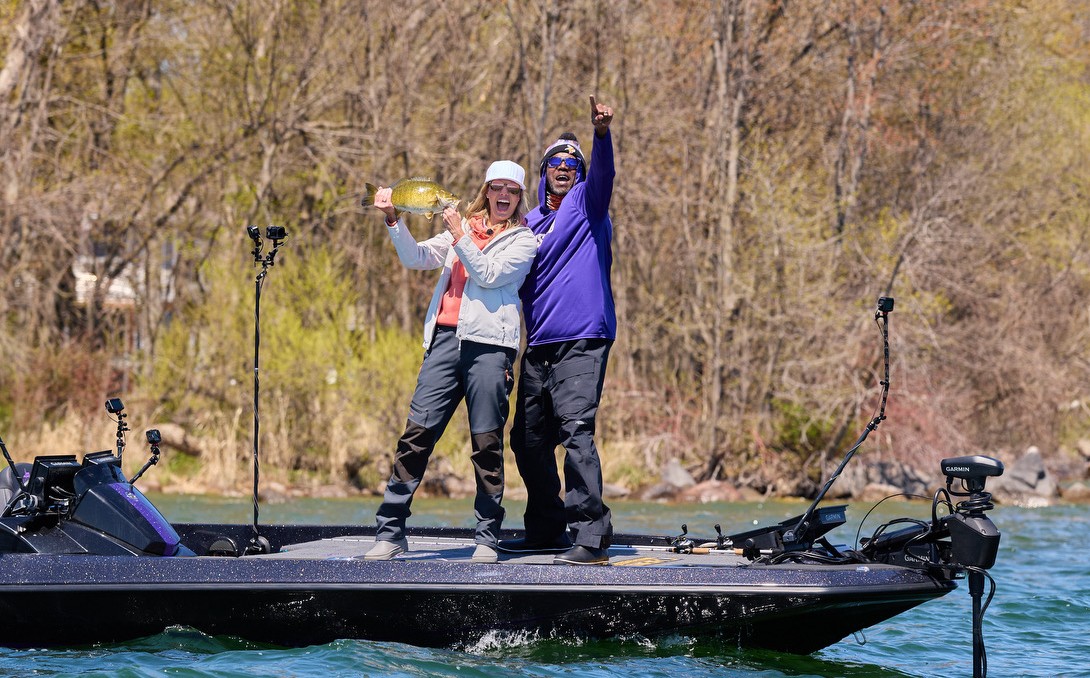 Randy and Kenna holding up a bass